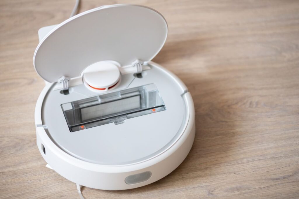 How does a robot vacuum empty itself?