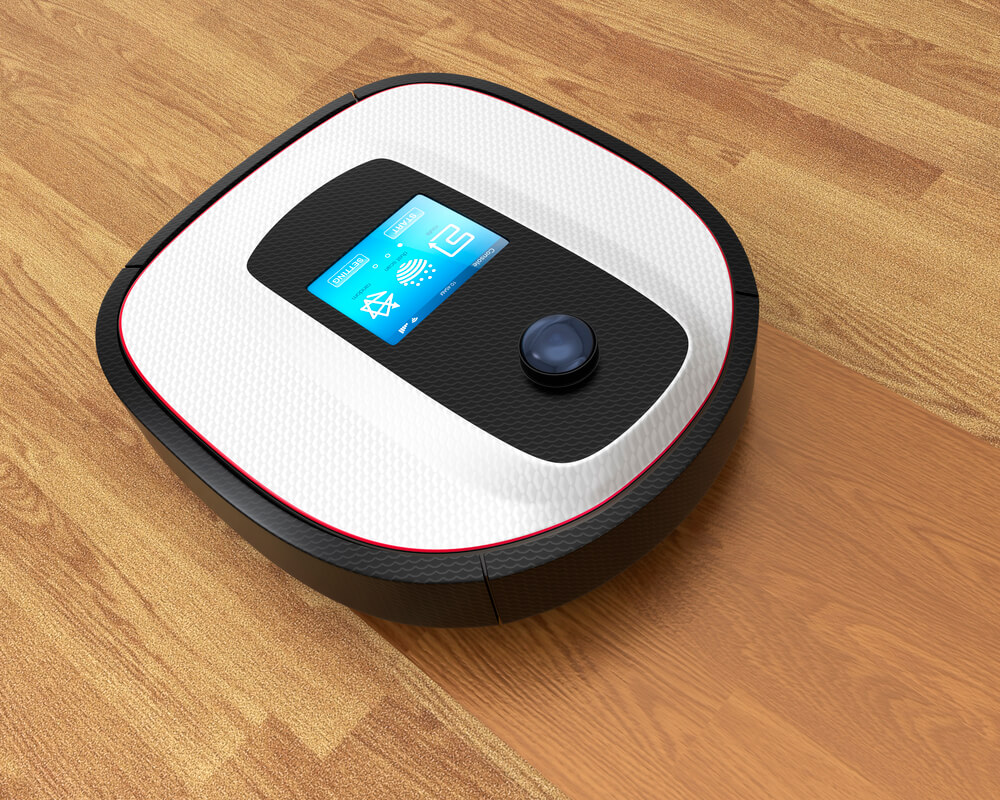 Can a Robot Vacuum Clean Multiple Rooms - a robot vacuum on a floor