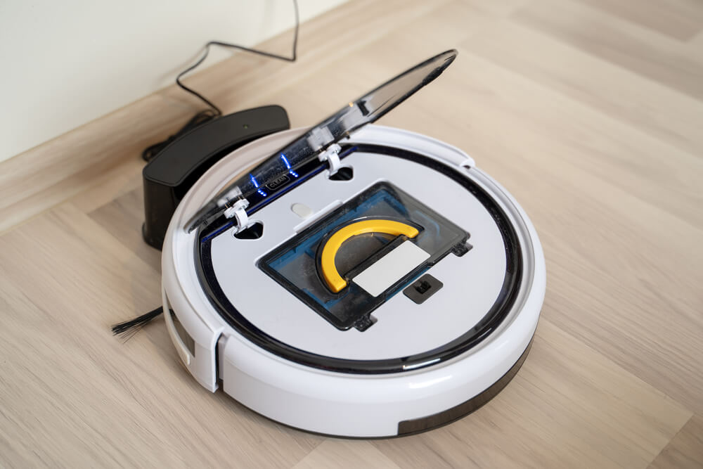 A robot vacuum cleaner with its top opened
